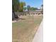 Landscaped grassy yard with mature trees and shrubs at 7009 E Acoma Dr # 2037, Scottsdale, AZ 85254