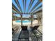 Community pool with pergola and lounge chairs at 7009 E Acoma Dr # 2037, Scottsdale, AZ 85254