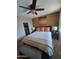 Spacious bedroom with king-size bed, ceiling fan, and large artwork at 7009 E Acoma Dr # 2037, Scottsdale, AZ 85254