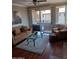 Bright living room with hardwood floors, comfy seating and glass coffee table at 7009 E Acoma Dr # 2037, Scottsdale, AZ 85254