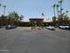 Community entrance with flag and parking lot at 7009 E Acoma Dr # 2037, Scottsdale, AZ 85254