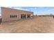 Single story home with covered patio and desert landscape at 37408 N 240Th Dr, Morristown, AZ 85342