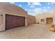 Spacious three-car garage with decorative wood doors at 37408 N 240Th Dr, Morristown, AZ 85342