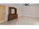 Well-lit bedroom with tiled floor and a dresser at 37408 N 240Th Dr, Morristown, AZ 85342