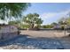 Gated entrance to Las Piedras community with stonework and landscaping at 32731 N 74Th Way, Scottsdale, AZ 85266