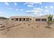 Modern home exterior with a three-car garage and desert landscaping at 39220 N 30Th Dr, Phoenix, AZ 85086