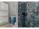 Stylish bathroom with blue tile shower and floating vanity at 39220 N 30Th Dr, Phoenix, AZ 85086