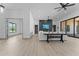 Open living space with stone fireplace and large windows at 39220 N 30Th Dr, Phoenix, AZ 85086