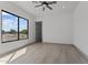 Bright bedroom with large window and ceiling fan at 39220 N 30Th Dr, Phoenix, AZ 85086