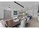 Dining room features a large wooden table and modern light fixture at 39220 N 30Th Dr, Phoenix, AZ 85086