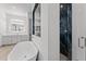 Spa-like bathroom featuring a freestanding tub and a large walk-in shower at 39220 N 30Th Dr, Phoenix, AZ 85086
