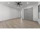 Spacious bedroom with gray sliding doors and hardwood floors at 39220 N 30Th Dr, Phoenix, AZ 85086