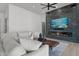 Living room featuring a modern fireplace and comfortable seating at 39220 N 30Th Dr, Phoenix, AZ 85086