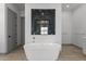 Luxurious bathroom with soaking tub, walk-in shower, and modern vanity at 39220 N 30Th Dr, Phoenix, AZ 85086