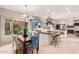 Modern kitchen with blue cabinets, a large island, and a breakfast nook at 8919 E Calle Del Palo Verde --, Scottsdale, AZ 85255