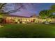 Spacious backyard featuring a large grassy area, pool, and home at 8919 E Calle Del Palo Verde --, Scottsdale, AZ 85255