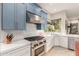 Modern kitchen with stainless steel appliances and blue cabinetry at 8919 E Calle Del Palo Verde --, Scottsdale, AZ 85255