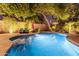 Stunning pool at night with beautiful lighting and landscaping at 8919 E Calle Del Palo Verde --, Scottsdale, AZ 85255