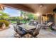Outdoor patio with dining table, lounge chair, and built-in grill at 8919 E Calle Del Palo Verde --, Scottsdale, AZ 85255