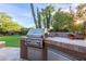 Built-in outdoor kitchen with stainless steel grill and ample counter space at 8919 E Calle Del Palo Verde --, Scottsdale, AZ 85255