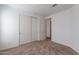 Bedroom with double door closet and neutral carpeting at 312 E O'Neil Dr # 128, Casa Grande, AZ 85122