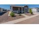 Single-story house with front porch and landscaping at 312 E O'Neil Dr # 128, Casa Grande, AZ 85122