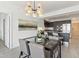 Modern dining room with glass table and chandelier at 7180 E Kierland Blvd # 509, Scottsdale, AZ 85254