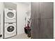 Laundry room with stackable washer and dryer and extra storage at 7180 E Kierland Blvd # 509, Scottsdale, AZ 85254