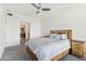 Main bedroom with large bed, nightstand, and ensuite bathroom at 7180 E Kierland Blvd # 509, Scottsdale, AZ 85254