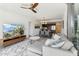 Open concept living room with modern furniture and large TV at 7180 E Kierland Blvd # 509, Scottsdale, AZ 85254
