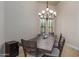 Formal dining room with wood table and chandelier at 16738 E Lone Mountain Rd, Scottsdale, AZ 85262