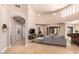 Open-concept living area featuring a comfortable sectional sofa and high ceilings at 16738 E Lone Mountain Rd, Scottsdale, AZ 85262