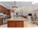 Open kitchen with island and views into Gathering room at 16738 E Lone Mountain Rd, Scottsdale, AZ 85262