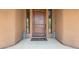 Inviting entryway with a wooden door and decorative accents at 16738 E Lone Mountain Rd, Scottsdale, AZ 85262