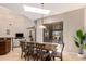 Kitchen dining area with wood table and chairs, and view to backyard at 16738 E Lone Mountain Rd, Scottsdale, AZ 85262