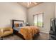 Bright bedroom with a queen bed and ample natural light at 16738 E Lone Mountain Rd, Scottsdale, AZ 85262