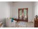 Relaxing bedroom with French doors leading to the outdoors at 16738 E Lone Mountain Rd, Scottsdale, AZ 85262