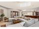 Spacious living room with large sectional sofa and high ceilings at 16738 E Lone Mountain Rd, Scottsdale, AZ 85262
