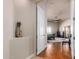 View of bedroom from hallway, hardwood floors and access to patio at 16738 E Lone Mountain Rd, Scottsdale, AZ 85262