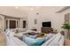 Comfortable living room with sectional sofa and built-in entertainment center at 16738 E Lone Mountain Rd, Scottsdale, AZ 85262