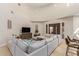 Spacious living room with a large sectional sofa and high ceilings at 16738 E Lone Mountain Rd, Scottsdale, AZ 85262