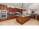 Spacious kitchen with wood cabinets and granite island at 16738 E Lone Mountain Rd, Scottsdale, AZ 85262