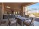 Covered patio with fire pit and seating at 16738 E Lone Mountain Rd, Scottsdale, AZ 85262