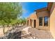 Charming home with stone pathway and desert landscaping at 16738 E Lone Mountain Rd, Scottsdale, AZ 85262