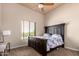 Bedroom with a queen-size bed and window view at 16738 E Lone Mountain Rd, Scottsdale, AZ 85262