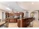 Gourmet kitchen with island, stainless steel appliances, and ample cabinet space at 16738 E Lone Mountain Rd, Scottsdale, AZ 85262