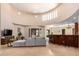 Open living area with sectional sofa, large TV, and access to backyard at 16738 E Lone Mountain Rd, Scottsdale, AZ 85262