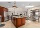 Open kitchen with large island and breakfast bar at 16738 E Lone Mountain Rd, Scottsdale, AZ 85262