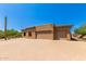 Three-car garage and expansive driveway characterize this home's exterior at 16738 E Lone Mountain Rd, Scottsdale, AZ 85262
