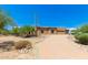 Beautiful desert landscape surrounds this single-story home with a large garage at 16738 E Lone Mountain Rd, Scottsdale, AZ 85262